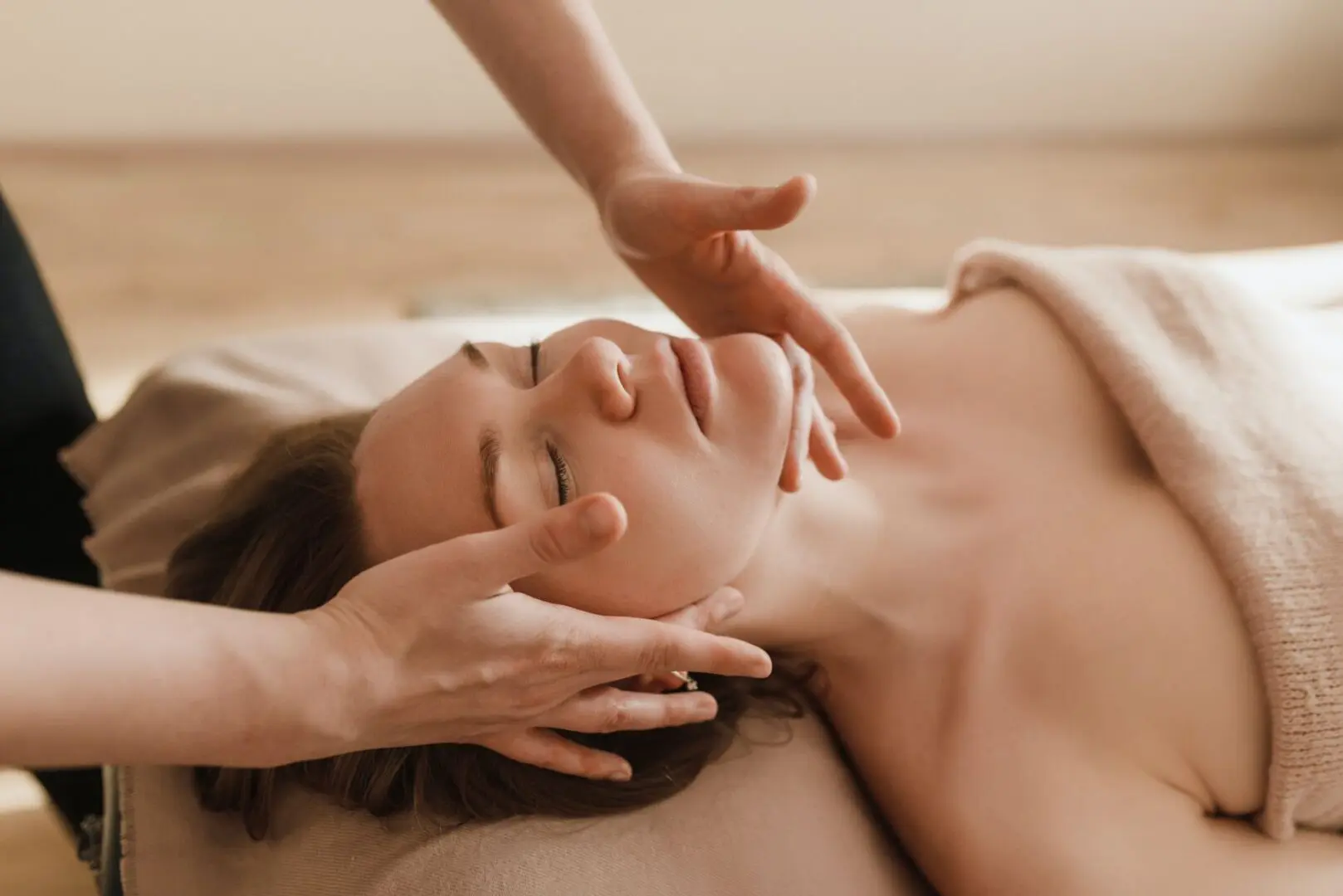 Young Woman Receiving Head Massage at spa